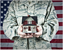 Veteran home buyer holding a model home